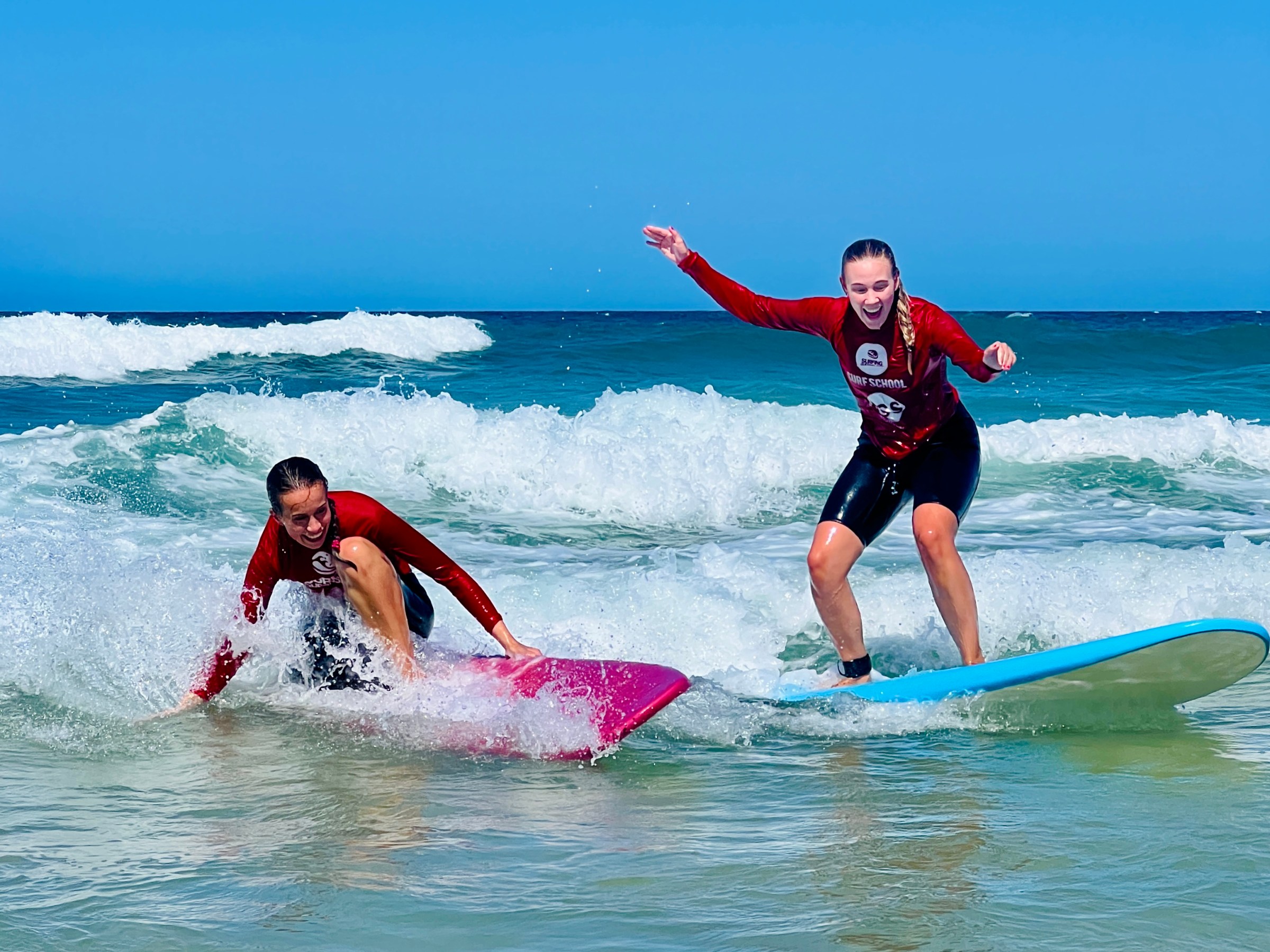 a girl riding a wave on a surfboard in the ocean