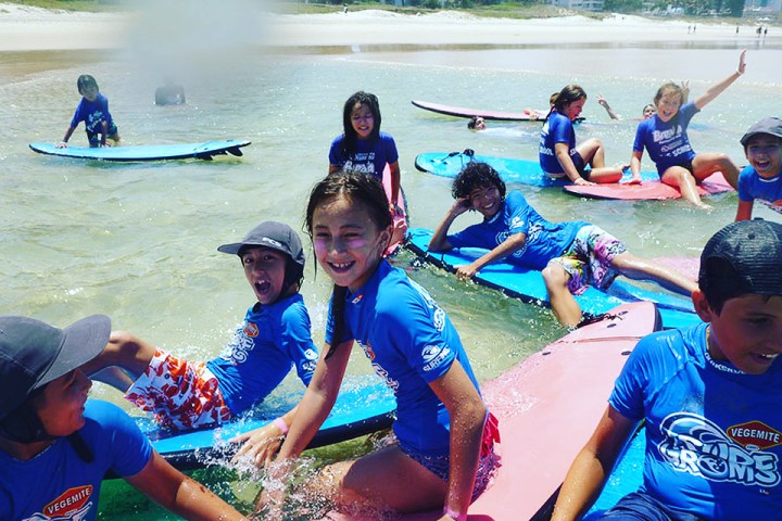 a group of people sitting at a beach