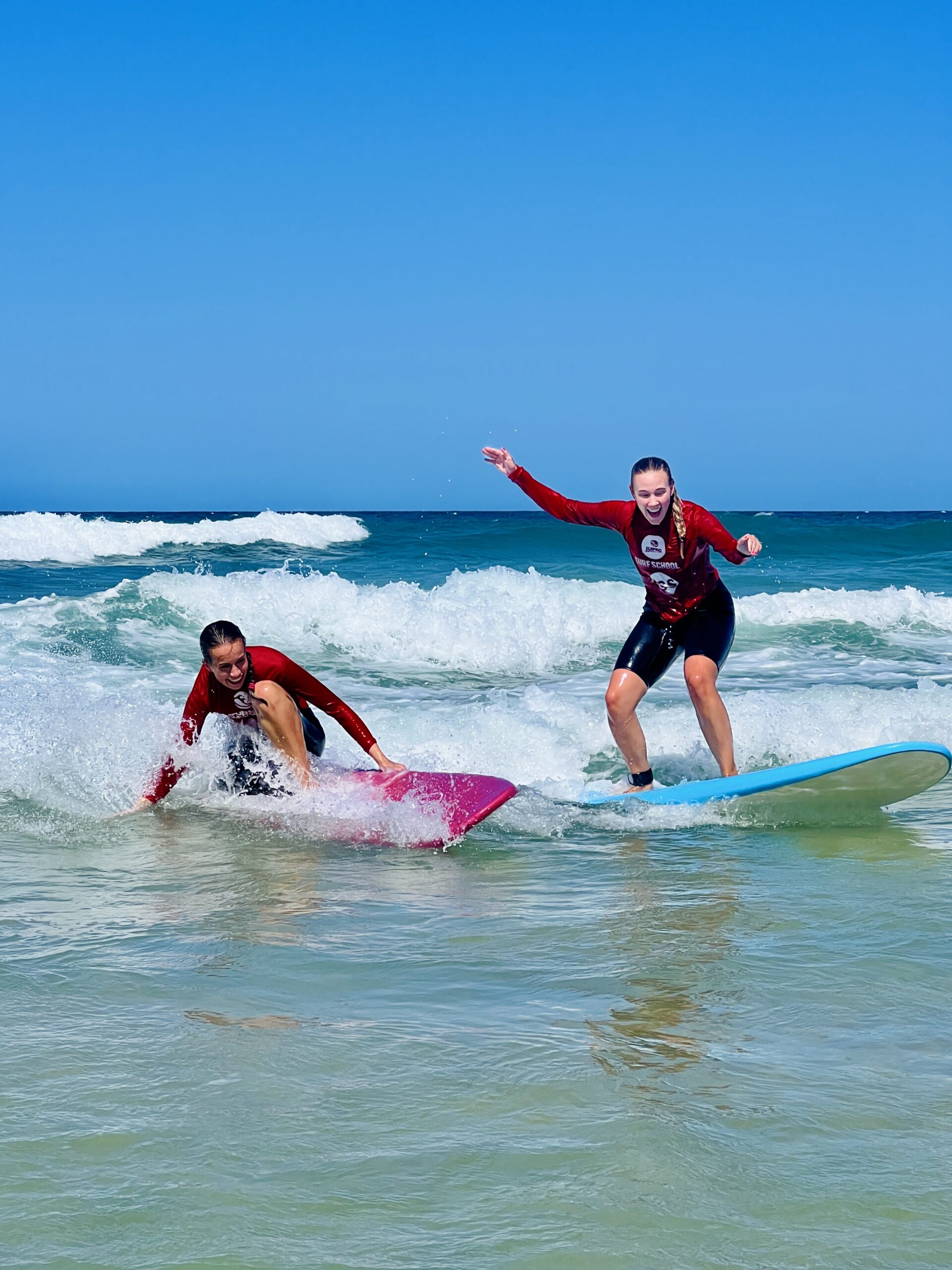 a girl riding a wave on a surfboard in the ocean