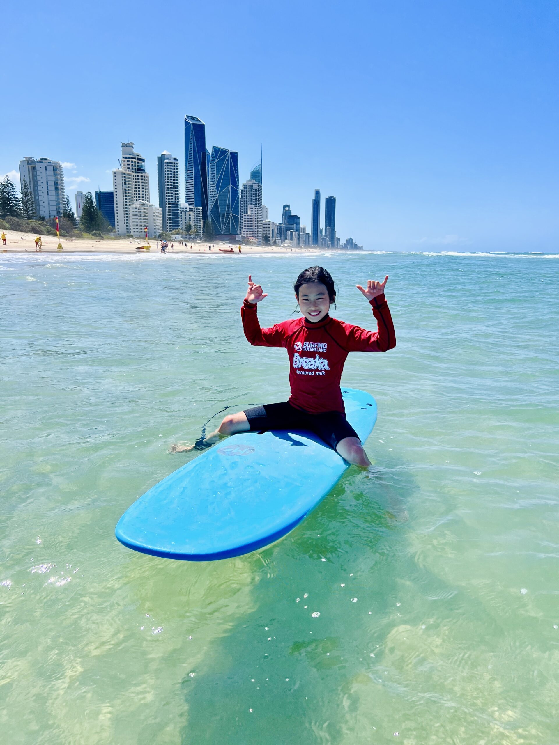 a person riding a surf board on a body of water