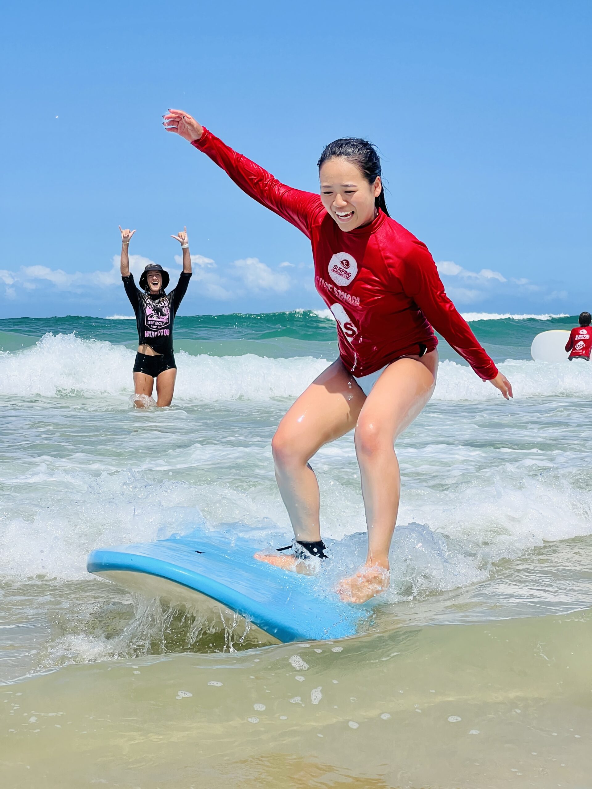 a person riding a surf board on a body of water