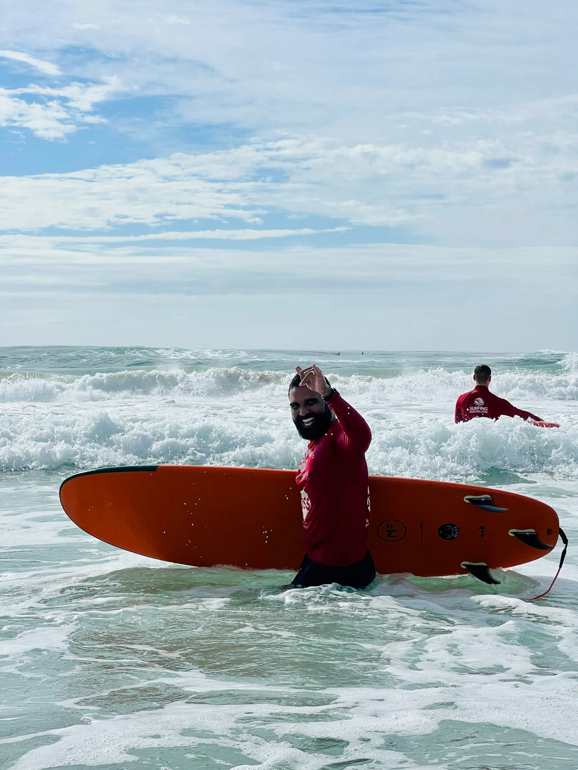 a girl riding a wave on a surfboard in the water